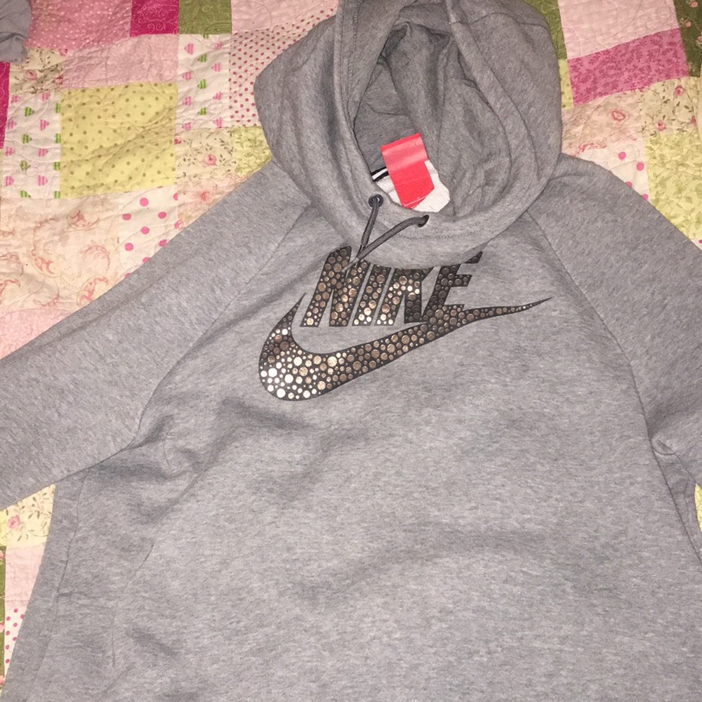 gray nike hoodie with a funnel neck style